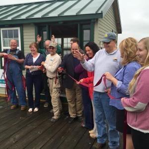 Wiscasset Area Chamber of Commerce members are all smiles after cutting the ribbon on the information center May 27. SUSAN JOHNS/Wiscasset Newspaper