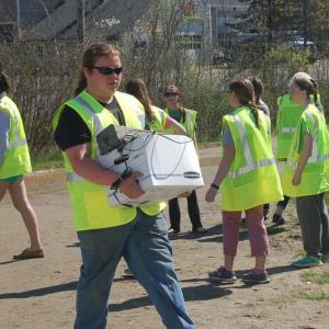 Lincoln Academy student Nate Courtenay carries used electronics for recycling. ART MAYERS/Boothbay Register