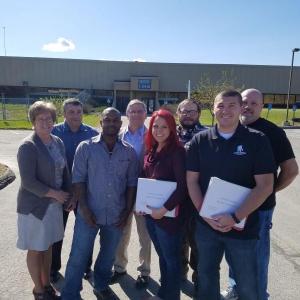 Pictured outside of the Department of Labor are, from left, Patty Daigle, Eric Dancer, Timothy Quirion, Sen. Chris Johnson, Jessica Chubbuck, Thomas Jent, Benjamin Leeman, and John Gardner. Courtesy photo