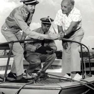 The uniforms may have changed but the USCG Auxiliary still checks the bow light as part of a free Vessel Safety Check or VSC for recreational boaters. The VSC process includes every item that will be checked if boarded by the Coast Guard, no fines will be levied or reports filed; the inspection results are confidential and serve only to give the boater a list of any items that may need repair or replacement. Courtesy of USCG Auxiliary archives