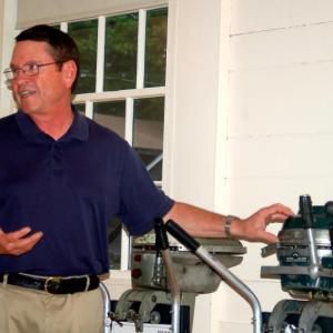 Larry Stevenson explains the virtues of one of the several motors that illustrate his lecture/slide show. ART MAYERS/Boothbay Register