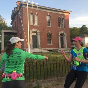 One runner’s leg ends in front of Wiscasset’s former customs house June 25, and a teammate’s leg begins, during the Rock Lobster Relay from Bar Harbor to Portland. SUSAN JOHNS/Wiscasset Newspaper