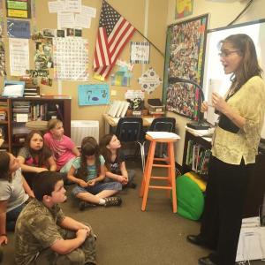 Erica Atkinson works with students in May at Dresden Elementary School. File photo