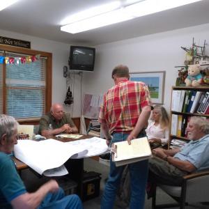 Discussion of the sand and salt shed project at the Westport Island town office. From left, George Richardson, Jerry Bodmer, Jonathan DeWick (back to camera), Lucinda Tilas and E. Davies Allan. JANE CARPENTER/Wiscasset Newspaper