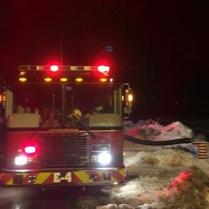 A Woolwich fire truck draws water from the Kennebec River early Christmas morning for use on a fire in Richmond. Courtesy of Woolwich Fire Department