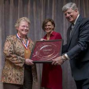 Cheryl Lee Rust, far left, accepts her award from Maine Restaurant Association’s board chairman Michelle Cory and MRA President Steve Hewins. Courtesy of Maine Restaurant Association