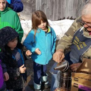 Peter Lammert demonstrates the bee smoker. Courtesy photo