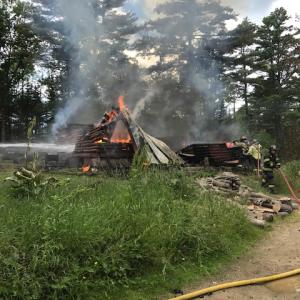 Wiscasset and Dresden firefighters fight the fire at 313 Bradford Road on June 28. Courtesy of Wiscasset Police Department