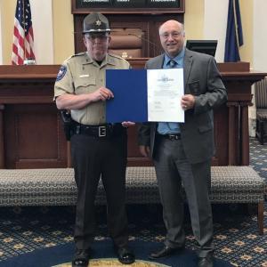 Senator Dana Dow presents Deputy Clayton Jordan with a Legislative Sentiment on May 30. Courtesy photo