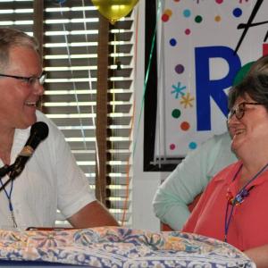 Dennis Hilton, president and CEO of Cheney Insurance, congratulates Rosemary Pinkham during her retirement celebration. Courtesy photo