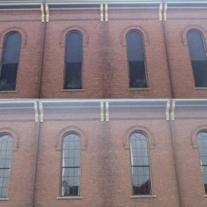 No longer boarded up! Half of the vintage 1875 unique antique windows have been restored. Courtesy of Andrew Fenniman