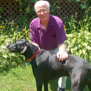 Optometrist Tom Nadeau with his dog Rhody. ART MAYERS/Boothbay Register