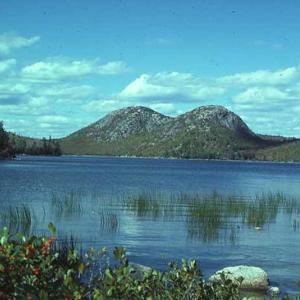 "The Bubbles" and Jordan Pond in Acadia National Park. These hills and valleys were sculpted by glacial erosion. The pond was dammed behind a moraine ridge during retreat of the ice sheet. Courtesy of Maine Geological Survey