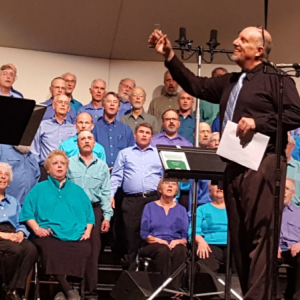 Steve Weston directing during a choral rehearsal. Courtesy of Penny Dunning