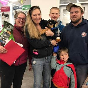 A family adopts a puppy at the last mega adoption event. Courtesy photo