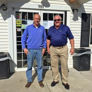 Russ Armstrong, in charge of the restoration at the new Boothbay Village Market, left, and Paul Coulombe, stand in front of the building. SUZI THAYER/Boothbay Register
