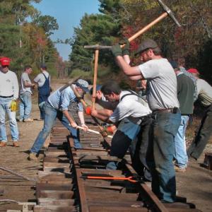 Volunteers drive spikes to build track the same way it was done when the WW&F was built in 1894. Courtesy photo