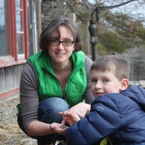 Abigail Manahan with her son on their farm in Alna. Courtesy photo