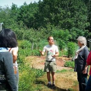 Aaron Parker, center, talking edible landscaping. Courtesy of Morris Farm
