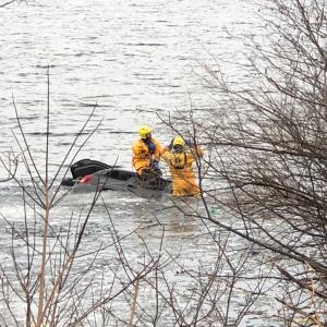 Rockport firefighters put on their cold water rescue gear this evening, March 23, to enter Chickawaukie Lake, in Rockport, to ensure no other victims were in the Jeep Grand Cherokee that landed in the water this evening, after leaving the Route 17 highway. (Photo courtesy Rockport Fire Department)