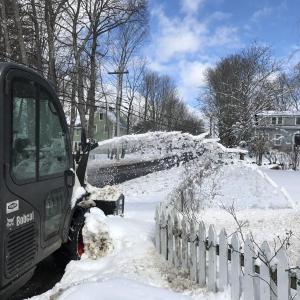 Equipment spurts out snow being removed from the Federal Street, Wiscasset sidewalk March 9, a day after several inches fell. SUSAN JOHNS/Wiscasset Newspaper