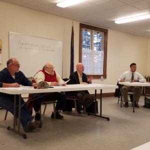 Dresden selectmen listen to Dave Probert talk about the recycling issue April 2. From left are Allan Moeller Sr., Dwight Keene, Chairman Dale Hinote, and Administrative Assistant Michael Henderson. KATRINA RICKERMANN/Wiscasset Newspaper