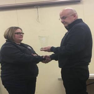 Kristin Draper accepts EMS Director Toby Martin’s congratulations for being named employee of the year. Courtesy photo