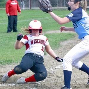 Maeve Blodgett scores for the Wolverines, beating the throw to Dirigo’s Sophia Jacques. PHIL DI VECE/Wiscasset Newspaper