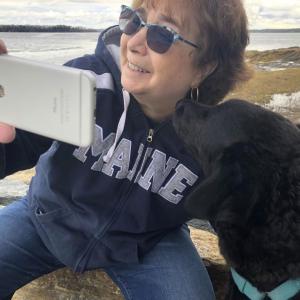Pamela Ferris-Olson with her Labradoodle Kipper demonstrating how to create a digital story. Courtesy photo