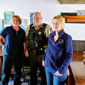 Clerks from Brown’s Wharf and T&D Variety with Sgt. Mark Bridgham of the Sheriff’s Office. Courtesy photo