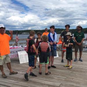 In 2017, Sheepscot River Race organizer Scott Shea, left, introduces the Camp Chewonki participants during the festivities after the race. Courtesy photo