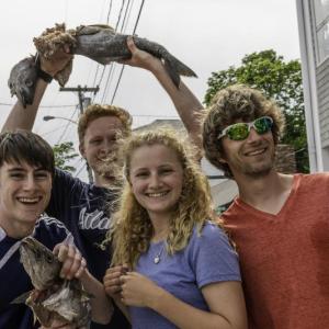 Boothbay Region High School track team members and their coach took first place in the 2018 Fish Relay Race during Windjammer Days on June 27. From left are Will Perkins, Aaron Densmore, Kelly Clarkson and coach Nick Scott. Jim Newton photo