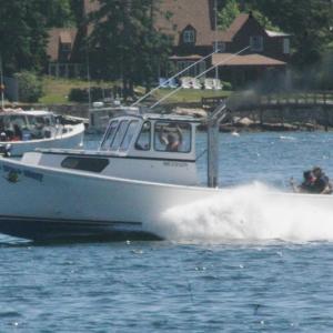 Racing lobster boat Wild, Wild West cooks up some wake during a season opener in Boothbay Harbor. KEVIN BURNHAM/Boothbay Register