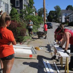 Members of St. Paul’s United Church of Christ work outside a home on Middle Street in Bath. PHIL DI VECE/Wiscasset Newspaper