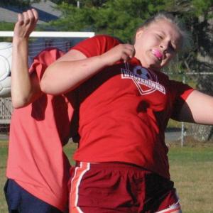 Brooke Thayer goes shoulder to shoulder with a Medomak player July 18. PHIL DI VECE/Wiscasset Newspaper