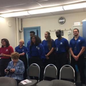 FEMA Corps members discuss the emergency pod project in Lincoln County. Leader Alexandra Tontisakis, standing, far left, explains the process of identifying sites for pods. GINA HAMILTON/Wiscasset Newspaper