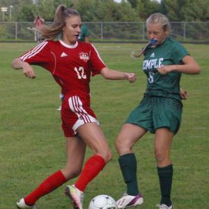 Wolverine Alyssa Bassett and Temple Academy’s Hannah Hubbard. PHIL DI VECE/Wiscasset Newspaper