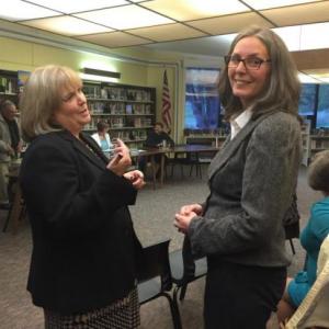 Then-principal Cheri Towle, left, speaks to Peg Armstrong just before Armstrong's confirmation as principal in 2015. File photo