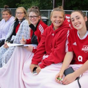D’Nisha Dawkins, Riley Trask, scorekeeper Sam Lakin, Lily Souza and Kayla Cossette are pictured from left prior to the start of Saturday’s game. PHIL DI VECE/Wiscasset Newspaper