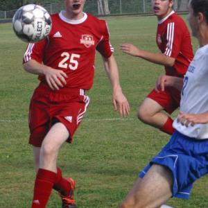Wiscasset/Boothbay’s Matt Smith, left, flanked by Bayly Gaugham-Carrasco. File photo
