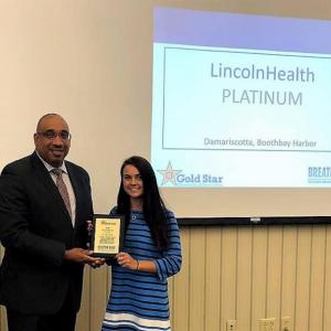 Brooke Alley of LincolnHealth accepts the 2018 Gold Star Standards of Excellence Awardees Platinum Level award from Kenneth I. Lewis, senior director for the MaineHealth Center for Tobacco Independence, at the awards ceremony Sept. 27. Courtesy photo