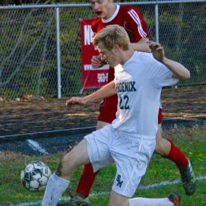 Wolverine Matt Chapman and Spruce Mountain’s John Brenner. PHIL DI VECE/Wiscasset Newspaper