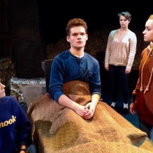 Seniors Kayleigh Tolley (Sister), Jonah Daiute (Don Quixote), Rachael Schuster (Antonia) and May Halm (Aldonza) rehearse the final scene in “Man of La Mancha.” Courtesy of Joy Braley