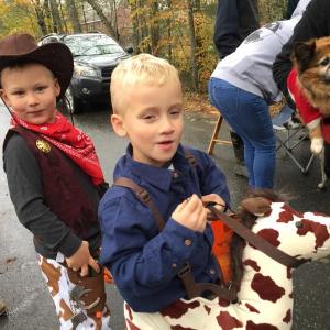 Newcastle twins Bow Verney, left, and Garrett Verney, 5, attend Trick or Treat Street as a cowboy and horse. SUSAN JOHNS/Wiscasset Newspaper
