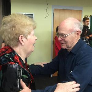 Lynn Murray of Gainsville, Florida and Wiscasset's Tony Gatti catch up at his surprise 80th birthday party at Wiscasset Community Center Dec. 15. SUSAN JOHNS/Wiscasset Newspaper