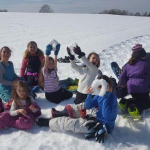 Kids get creative with snow at DRA’s winter vacation camp. Courtesy of DRA