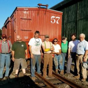 Volunteers from both the MNG and WW&F work together in the Portland yard to ready several box cars for the move to Alna last summer. Courtesy of Wesley Heinz