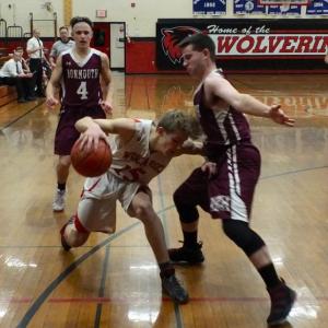 Toe to toe are Wiscasset's Matt Chapman and Monmouth Academy’s Trevor Flanagan. That’s Monmouth’s Dylan Lajoie in the background. PHIL DI VECE/Wiscasset Newspaper
