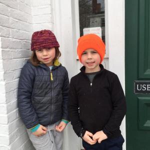 Hannah Cheney, 7, of Alna and brother Sawyer, 6, return books to Wiscasset Public Library Jan. 6. SUSAN JOHNS/Wiscasset Newspaper