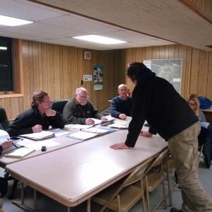 Edgecomb Selectman Mike Smith, standing, talks with the ordinance committee Jan. 3 about concerns over drainage creating an ice hazard on the town’s roads. JANE CARPENTER/Boothbay Register